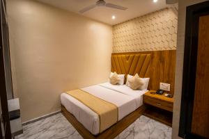 Postel nebo postele na pokoji v ubytování Hotel BKC Prime Near Trade Centre US Embassy, Mumbai