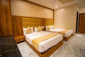 Postel nebo postele na pokoji v ubytování Hotel BKC Prime Near Trade Centre US Embassy, Mumbai
