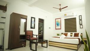 Postel nebo postele na pokoji v ubytování Hotel Gold Suite, Kakkanad