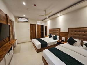 Postel nebo postele na pokoji v ubytování Hotel BKC Garden - Near US Embassy Bkc Mumbai + 29 fotografií