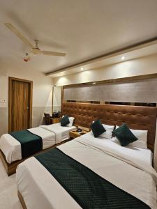 Voodi või voodid majutusasutuse Hotel BKC Garden - Near US Embassy Bkc Mumbai toas