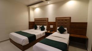 Voodi või voodid majutusasutuse Hotel BKC Garden - Near US Embassy Bkc Mumbai toas