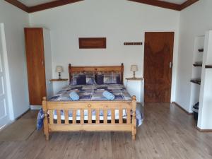 Postel nebo postele na pokoji v ubytování Nandi's Place