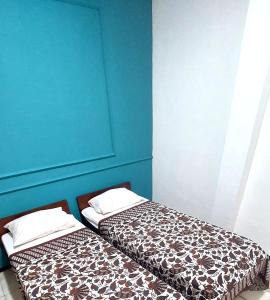 Ένα ή περισσότερα κρεβάτια σε δωμάτιο στο Riche Heritage Hotel