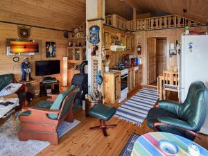 a living room filled with furniture in a cabin at 6 person holiday home in BORKENES-By Traum in Harstad
