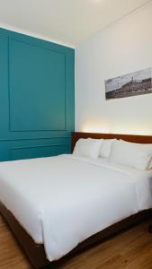 Ένα ή περισσότερα κρεβάτια σε δωμάτιο στο Riche Heritage Hotel