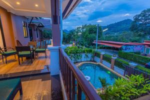 a view from the balcony of a house with a swimming pool at Monica Villa 24 in Ao Nang Beach