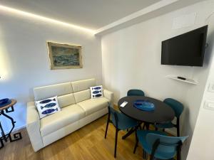 a living room with a couch and a table at La Casa Rotonda in Portovenere