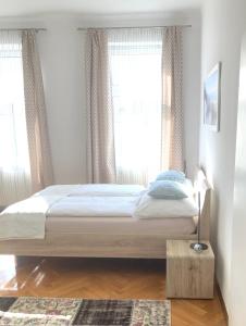 Posteľ alebo postele v izbe v ubytovaní Apartment Villa Penzing