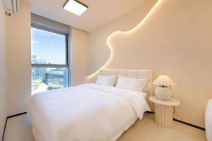 Postel nebo postele na pokoji v ubytování Dream Inn Hotel Beijing