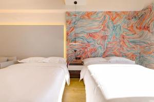 Postel nebo postele na pokoji v ubytování Dream Inn Hotel Beijing