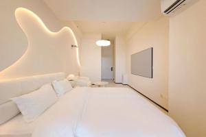 Postel nebo postele na pokoji v ubytování Dream Inn Hotel Beijing