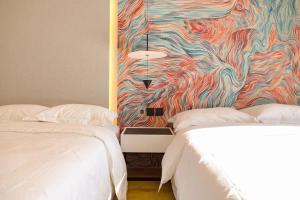 Postel nebo postele na pokoji v ubytování Dream Inn Hotel Beijing