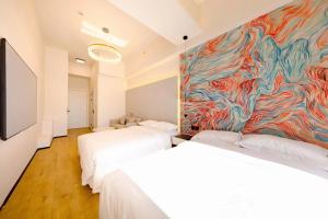 Postel nebo postele na pokoji v ubytování Dream Inn Hotel Beijing
