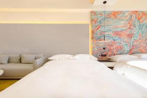 Postel nebo postele na pokoji v ubytování Dream Inn Hotel Beijing