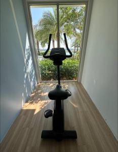 a camera on a tripod in front of a window at Serene Stay in Klang, Malaysia in Klang