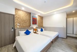 Letto o letti in una camera di TP Dalat Hotel