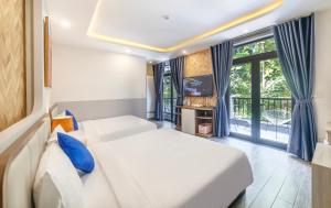 Letto o letti in una camera di TP Dalat Hotel