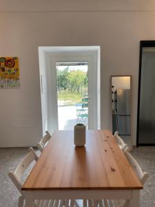 a wooden table with two chairs in a room at Casa Vacanze La Quercia in San Vito Chietino
