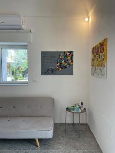 a living room with a couch and a table at Casa Vacanze La Quercia in San Vito Chietino