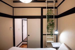 Postel nebo postele na pokoji v ubytování 雲川居 Unsenkyou