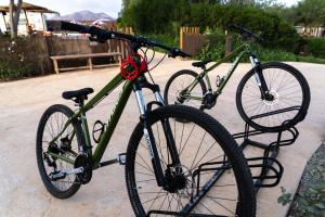 two bikes are parked next to each other at TAIGA Almeria Playa in Palomares