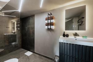 Koupelna v ubytování Atpūtas komplekss Pazust Priedēs - AURORA house + 32 fotografií