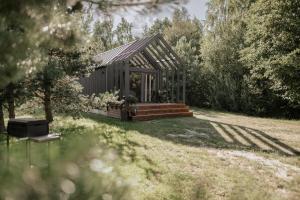 Zahrada ubytování Atpūtas komplekss Pazust Priedēs - AURORA house