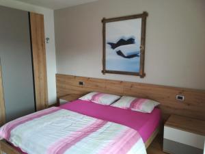 Postel nebo postele na pokoji v ubytování Casa Brugnara + 6 fotografií