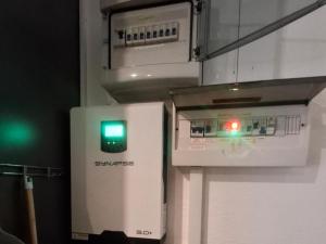an appliance with a green light next to a stove at Sunshine Cottage in Pennington