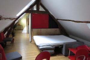 Postel nebo postele na pokoji v ubytování logement a l'étage d'une longère Normande