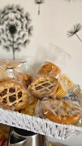 a tray of pies and pastries on a table at Melissa lux in Ciampino