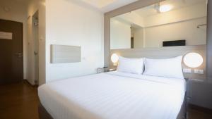 Red Planet Makati Avenue Manila客房内的一张或多张床位