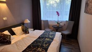 Un pat sau paturi într-o cameră la Apartment in Tulln an der Donau