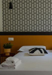 Postel nebo postele na pokoji v ubytování FEEL - Mille Suites