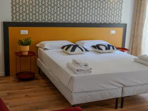 Postel nebo postele na pokoji v ubytování FEEL - Mille Suites