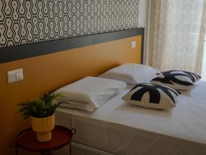 Postel nebo postele na pokoji v ubytování FEEL - Mille Suites