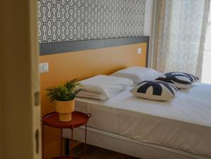 Postel nebo postele na pokoji v ubytování FEEL - Mille Suites