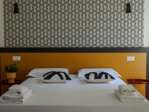 Postel nebo postele na pokoji v ubytování FEEL - Mille Suites