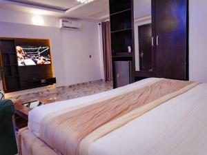 Voodi või voodid majutusasutuse 247 Luxury Hotel toas
