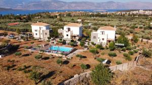 an aerial view of a villa with a swimming pool at Studio Καρπώ Karpo in Galaxidi