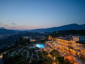 an aerial view of a city at night at Hotel Boffenigo - The Golden Hour in Costermano