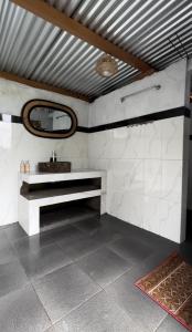 a bathroom with a sink and a mirror at Kubah Bali Glamping in Kintamani