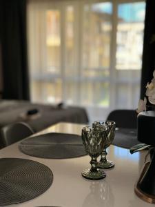 a table with a glass bowl on top of a table at Студия Sea Breeze in Sveti Vlas +31 photos