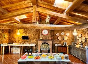 a room with a table with food on it at Quinta do Nobre in Marialva