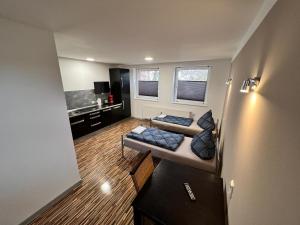 a living room with a couch and a table at AlWi Apartment Braunschweig in Braunschweig