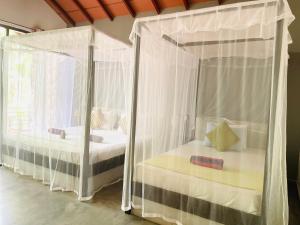 Letto o letti in una camera di Mango Tree House