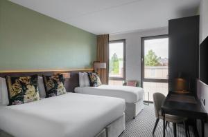 Letto o letti in una camera di Monet Garden Hotel Amsterdam