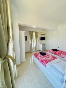 Postel nebo postele na pokoji v ubytování El Mesala Hotel