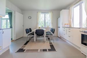 a dining room with a table and chairs at Explorer apartment in Stamsund in Stamsund
